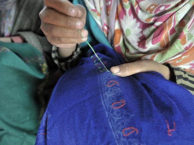 The intricate art of embroidery is mastered by Kashmiri women, who are paid a meagre monthly stipend of Rs 700 for their work on handicraft products like curtains, shawls and carpets. (Waseem Andrabi/ HT Photo)