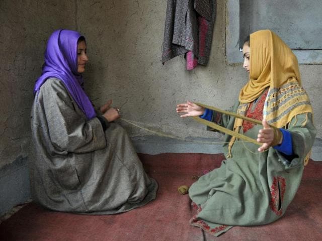 Kashmiri women choose the thread before using them on window curtains at a state-run centre in Shelwat in north Kashmir, some 30kms from Srinagar. (Waseem Andrabi/ HT Photo)