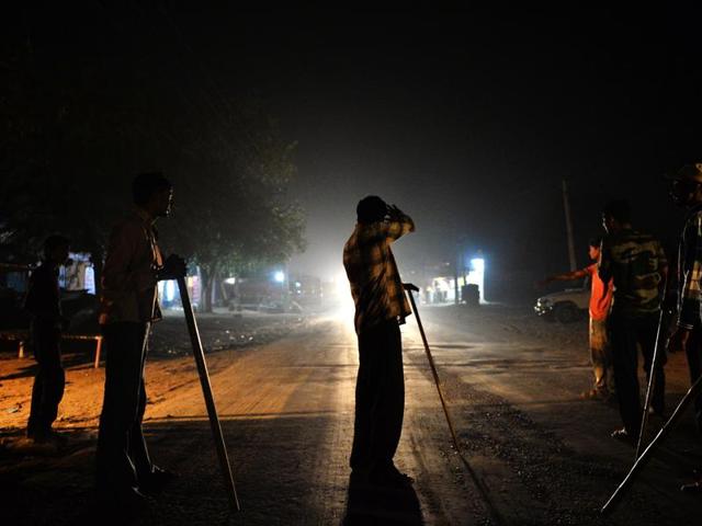 Volunteers of the vigilante group of Gau Raksha Dal (Cow Protection Squad) gather to inspect a truck on a highway in Taranagar, Rajasthan. An unidentified ‘cow protection vigilante’ team shot dead a migrant worker in Karnal. (AFP File Photo) Volunteers of the vigilante group of Gau Raksha Dal (Cow Protection Squad) gather to inspect a truck on a highway in Taranagar, Rajasthan. An unidentified ‘cow protection vigilante’ team shot dead a migrant worker in Karnal. (AFP File Photo)