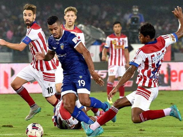 Chennaiyin FC player vies for the ball with Atletico de Kolkata players during an ISL match in Kolkata on November 18, 2015.(PTI Photo)