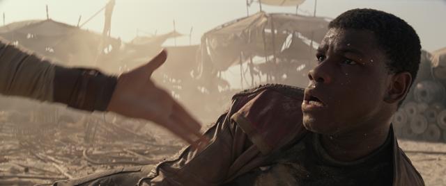 This photo provided by Disney/Lucasfilm shows Daisey Ridley’s Rey, as she offers a hand to John Boyega’s Finn, in a scene from the new film, Star Wars: The Force Awakens, directed by JJ Abrams. (AP) This photo provided by Disney/Lucasfilm shows Daisey Ridley’s Rey, as she offers a hand to John Boyega’s Finn, in a scene from the new film, Star Wars: The Force Awakens, directed by JJ Abrams. (AP)