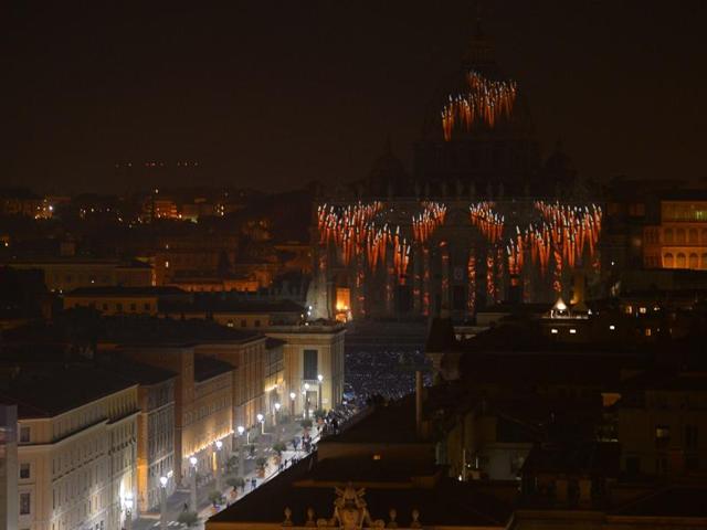 A picture is projected on St Peter’s Basilica during the ‘Fiat Lux : Illuminating Our Common Home’ show at the Vatican. (AFP)