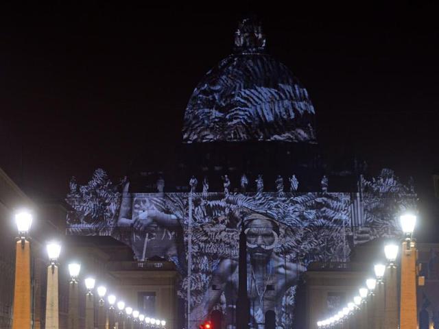 Pictures by some of the world's greatest environmental photographers, including Sebastião Salgado, Joel Sartore, Yann Arthus-Bertrand and Louie Schwartzberg, are projected in solidarity with COP21 climate change talks in Paris. (AFP Photo)