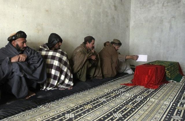 Afghan men mourn near the coffin of Mohammad Sami, 21, who was killed in clashes between Taliban fighters and Afghan forces. (AP) Afghan men mourn near the coffin of Mohammad Sami, 21, who was killed in clashes between Taliban fighters and Afghan forces. (AP)