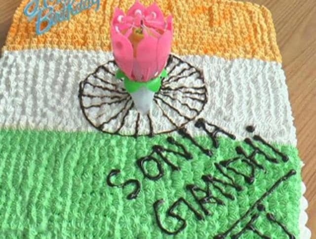 The cake depicting the national flag was cut by a Congress leader on the 69th birthday of party chief Sonia Gandhi in Sirsa on Wednesday.(HT photo)