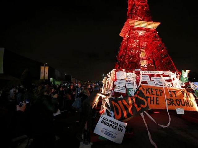 People demonstrate in front of a replica of the Eiffel Tower at the World Climate Change Conference 2015 (COP21) at Le Bourget. (REUTERS) People demonstrate in front of a replica of the Eiffel Tower at the World Climate Change Conference 2015 (COP21) at Le Bourget. (REUTERS)