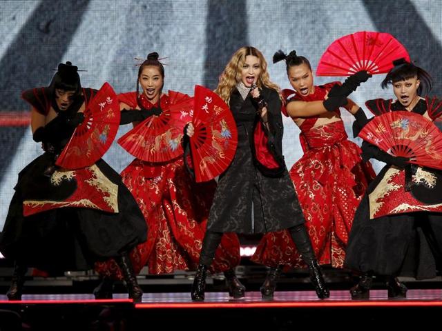 Singer Madonna surrounded by fierce, warrior-like performers at her grand Paris gig. (REUTERS) Singer Madonna surrounded by fierce, warrior-like performers at her grand Paris gig. (REUTERS)