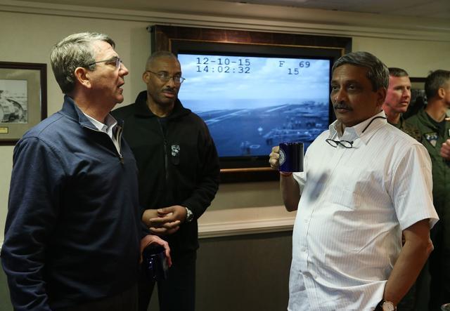 US defense secretary Ash Carter (L) talks with India's minister of defense Manohar Parrikar (R) as rear admiral Jesse A Wilson (2L) stands nearby on the USS Eisenhower. (AFP) US defense secretary Ash Carter (L) talks with India's minister of defense Manohar Parrikar (R) as rear admiral Jesse A Wilson (2L) stands nearby on the USS Eisenhower. (AFP)
