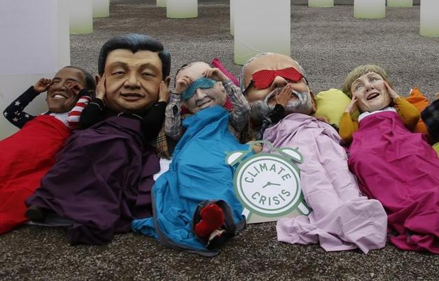 Activists of global anti-poverty charity Oxfam wearing masks depicting some of the world leaders stage a protest outside the venue of the World Climate Change Conference 2015 near Paris. (Reuters) Activists of global anti-poverty charity Oxfam wearing masks depicting some of the world leaders stage a protest outside the venue of the World Climate Change Conference 2015 near Paris. (Reuters)
