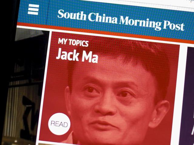 The South China Morning Post website and an image of Jack Ma, founder and executive chairman of Alibaba Group Holding, are displayed on a computer in Hong Kong, China. The Chinese e-commerce giant said it would buy publisher SCMP Group Ltd's media assets. (Reuters File Photo)