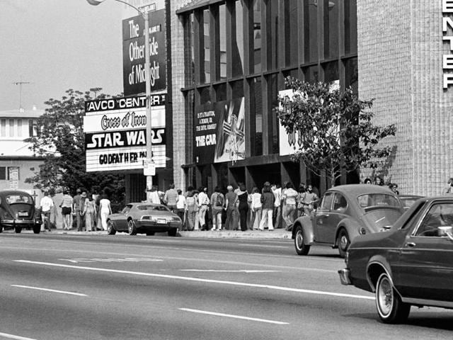 In this June 7, 1977 file photo, theatre goers wait in line here at Avco Center Theater in Los Angeles to see the smash-hit movie, Star Wars, which had seats sold out for every performance and had grossed $5.2 million since it opened 12 days ago.  (AP) 