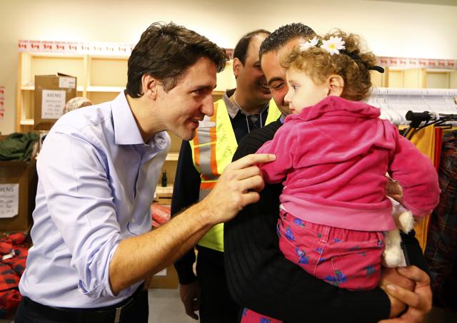 Canada welcomed 163 Syrian refugees, taking in the first of a planned 25,000 in a matter of months and promising them a better life as they flee their country’s horrific war. Prime Minister Trudeau said, “Tonight they step off the plane as refugees. But they walk out of this terminal as permanent residents of Canada...” (Reuters )