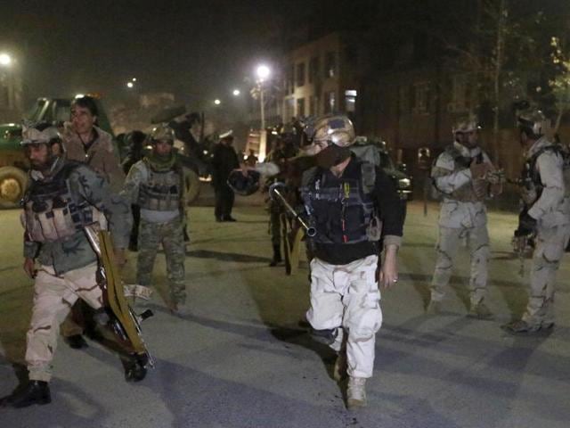 Members of the Afghan Crisis Response Unit (CRU) arrive at the site of a Taliban attack in Kabul, Afghanistan. A loud explosion rocked Kabul on Friday in a heavily protected area close to many foreign embassies and government buildings, with initial reports suggesting at least three attackers had targeted a guesthouse close to the Spanish embassy. (Reuters Photo) Members of the Afghan Crisis Response Unit (CRU) arrive at the site of a Taliban attack in Kabul, Afghanistan. A loud explosion rocked Kabul on Friday in a heavily protected area close to many foreign embassies and government buildings, with initial reports suggesting at least three attackers had targeted a guesthouse close to the Spanish embassy. (Reuters Photo)
