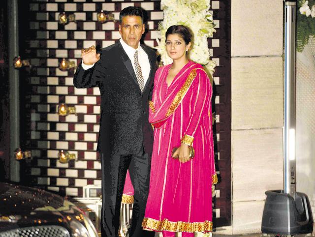 Akshay Kumar with wife Twinkle Khanna at the bash to celebrate the two weddings. (HT Photo)