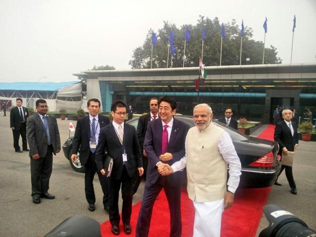 PM Narendra Modi welcomes Japanese Prime Minister Shinzo Abe at an airport in New Delhi as the two take a flight to Varanasi on Saturday. (Twitter/Vikas Swarup) PM Narendra Modi welcomes Japanese Prime Minister Shinzo Abe at an airport in New Delhi as the two take a flight to Varanasi on Saturday. (Twitter/Vikas Swarup)