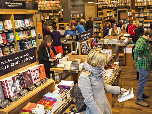 The old-fashioned way: Amazon opened its first physical bookstore in November this year in Seattle. (Photo by Stephen Brashear/Getty Images)(Getty Images) The old-fashioned way: Amazon opened its first physical bookstore in November this year in Seattle. (Photo by Stephen Brashear/Getty Images)(Getty Images)