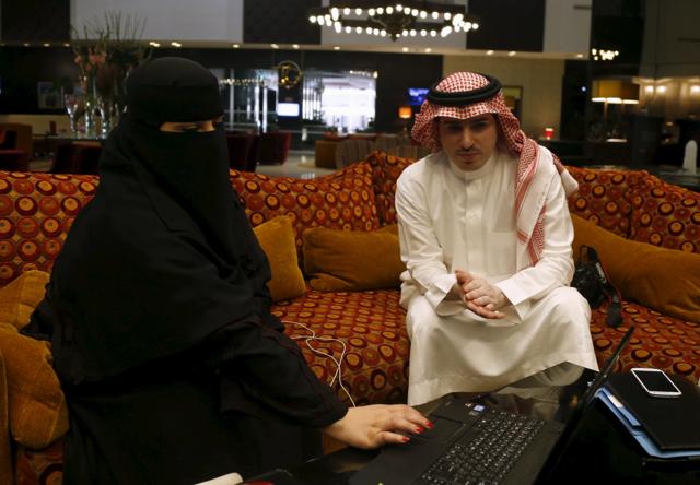 Saudi woman Fawzia al-Harbi, a candidate for local municipal council elections, uses her laptop as she sits next to one of her chaperones at a shopping mall in Riyadh. The vote is just the first step in gender equality in the autocratic Saudi kingdom. (REUTERS Photo) Saudi woman Fawzia al-Harbi, a candidate for local municipal council elections, uses her laptop as she sits next to one of her chaperones at a shopping mall in Riyadh. The vote is just the first step in gender equality in the autocratic Saudi kingdom. (REUTERS Photo)