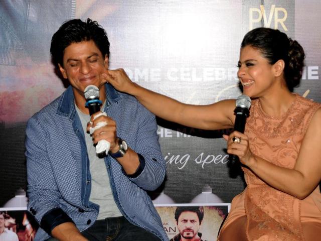 Kajol was spotted playing the mommy and pulling Shah Rukh Khan’s cheeks at a promotional event for their upcoming film Dilwale in Mumbai on December 11, 2015. (AFP)