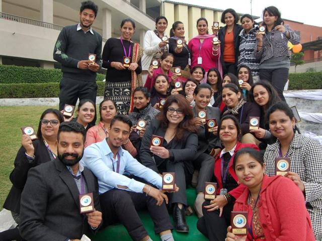 Teachers and other staff members of Oakridge International School posing for photograph during a function in SAS Nagar on Friday.
