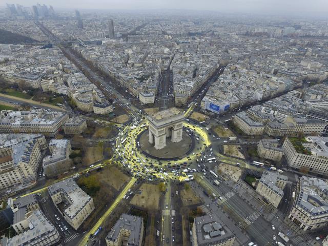 Yellow paint, symbolising the sun and its rays, is seen around the Arc de Triomphe during a protest on Champs Elysees avenue on the sidelines of the World Climate Change Conference 2015 (COP21), in Paris. (REUTERS) Yellow paint, symbolising the sun and its rays, is seen around the Arc de Triomphe during a protest on Champs Elysees avenue on the sidelines of the World Climate Change Conference 2015 (COP21), in Paris. (REUTERS)