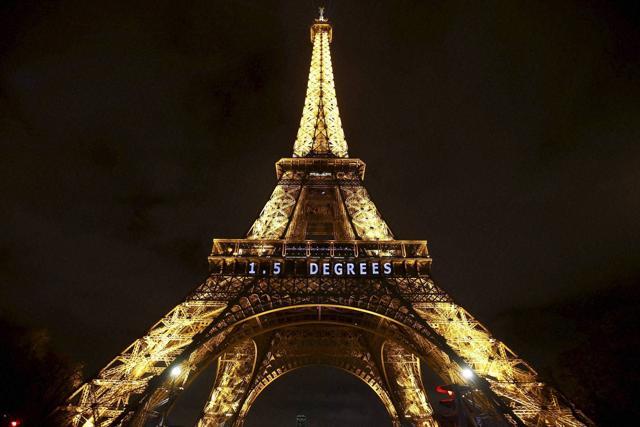 The slogan "1.5 degrees" is projected on the Eiffel Tower as part of the COP21, United Nations Climate Change Conference in Paris, France. (AP Photo) The slogan "1.5 degrees" is projected on the Eiffel Tower as part of the COP21, United Nations Climate Change Conference in Paris, France. (AP Photo)