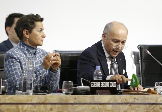 French foreign affairs minister Laurent Fabius (R), President-designate of COP21, uses his gavel next to Christiana Figueres (L), executive secretary of the UN Framework Convention on Climate Change during the final plenary session at the World Climate Change Conference 2015 (COP21) at Le Bourget near Paris on Saturday. (REUTERS) French foreign affairs minister Laurent Fabius (R), President-designate of COP21, uses his gavel next to Christiana Figueres (L), executive secretary of the UN Framework Convention on Climate Change during the final plenary session at the World Climate Change Conference 2015 (COP21) at Le Bourget near Paris on Saturday. (REUTERS)