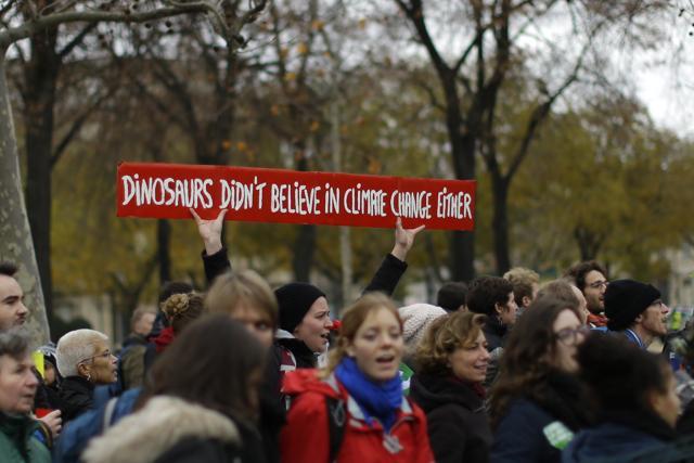 Activists demonstrate with a banner near the Eiffel Tower, in Paris, during the COP21 -- the United Nations Climate Change Conference. . (AP Photo) Activists demonstrate with a banner near the Eiffel Tower, in Paris, during the COP21 -- the United Nations Climate Change Conference. . (AP Photo)