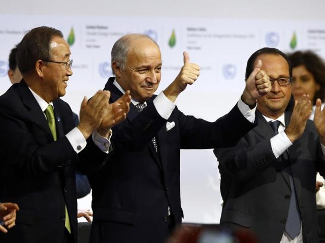 French President Francois Hollande, right, French foreign minister and president of the COP21 Laurent Fabius, second, right, United Nations climate chief Christiana Figueres and United Nations Secretary General Ban ki-Moon applaud after the final conference at the COP21.(AP)