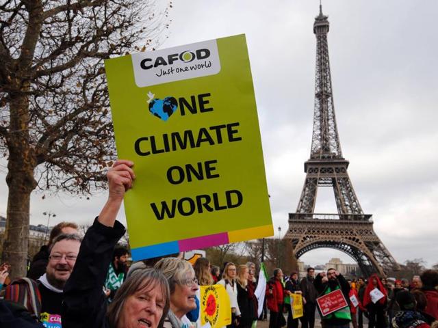 The slogan "No Plan B" is projected on the Eiffel Tower as part of the World Climate Change Conference 2015 (COP21) in Paris on Friday. Developing countries like India expect enhanced funds from the rich world — which has pledged $100 billion in green funds — for post-2020 period when the deal comes into force.(Reuters)