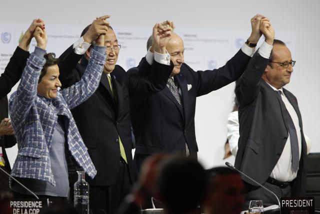 Envoys from 195 nations on December 12 adopted to cheers and tears a historic accord to stop global warming, which threatens humanity with rising seas and worsening droughts, floods and storms. (AFP Photo) Envoys from 195 nations on December 12 adopted to cheers and tears a historic accord to stop global warming, which threatens humanity with rising seas and worsening droughts, floods and storms. (AFP Photo)