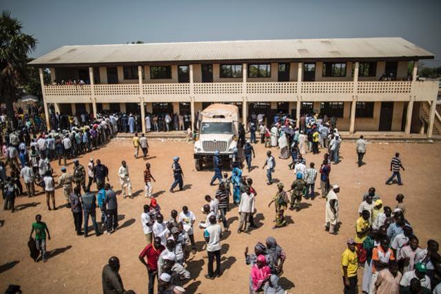 Voters meet in the courtyard of a polling station moments before heavy gunfire was directed towards the Baya Dombia school on December 13, in Bangui. (AFP Photo) Voters meet in the courtyard of a polling station moments before heavy gunfire was directed towards the Baya Dombia school on December 13, in Bangui. (AFP Photo)