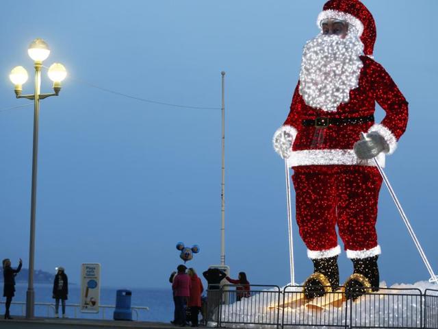A giant illuminated Santa Claus model is displayed along the Promenade des Anglais in the French Riviera city of Nice, southeastern France, on December 12, 2015. (AFP)
