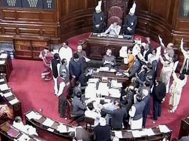 Opposition members protest in the well of the Rajya Sabha in New Delhi on Monday. (PTI) Opposition members protest in the well of the Rajya Sabha in New Delhi on Monday. (PTI)