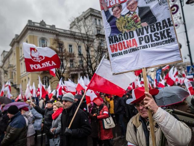 Supporters of Poland's ruling party Law and Justice (PiS) rally for a pro-government demonstration, December 13, 2015 in Warsaw.(AFP)