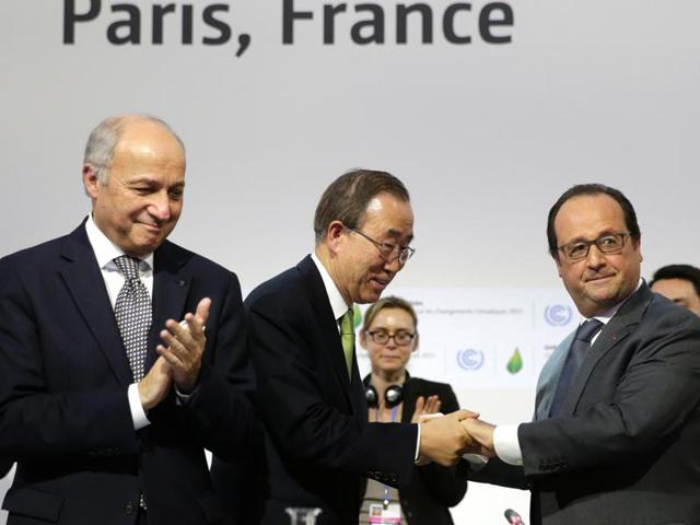 French President Francois Hollande (R) shakes hands with UN secretary general Ban Ki-moon next to French foreign minister and COP21 president Laurent Fabius (L) during the final session of the COP21 United Nations climate change conference in Le Bourget near Paris on Saturday. (AFP) French President Francois Hollande (R) shakes hands with UN secretary general Ban Ki-moon next to French foreign minister and COP21 president Laurent Fabius (L) during the final session of the COP21 United Nations climate change conference in Le Bourget near Paris on Saturday. (AFP)