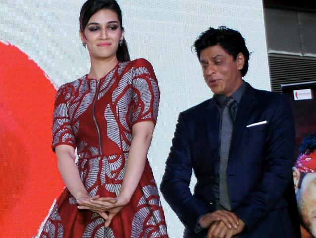 Indian Bollywood actors Kriti Sanon and Shah Rukh Khan perform during the music celebration of the upcoming Hindi film Dilwale, directed by Rohit Shetty in Mumbai. (AFP)
