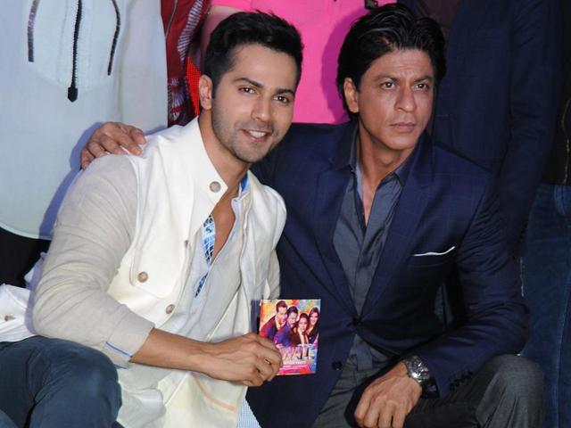 Varun Dhawan and Shah Rukh Khan pose during the music celebration of the upcoming Hindi film Dilwale. (AFP)