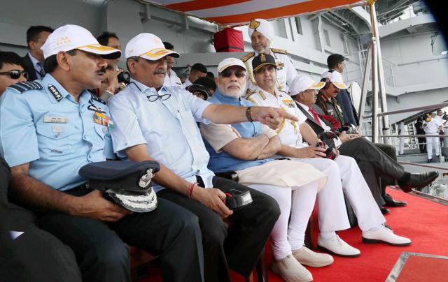 Prime Minister Narendra Modi, flanked by Union Minister for Defence, Manohar Parrikar, the Chief of the Air Staff, Air Chief Marshal Arup Raha, the Chief of Army Staff, General Dalbir Singh and the Chief of Naval Staff, Admiral R.K. Dhowan, witnessing the operational demonstrations at INS Vikramaditya, in Kochi. (PTI) Prime Minister Narendra Modi, flanked by Union Minister for Defence, Manohar Parrikar, the Chief of the Air Staff, Air Chief Marshal Arup Raha, the Chief of Army Staff, General Dalbir Singh and the Chief of Naval Staff, Admiral R.K. Dhowan, witnessing the operational demonstrations at INS Vikramaditya, in Kochi. (PTI)