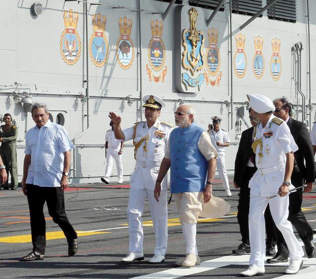 Prime Minister Narendra Modi with Union Minister for Defence, Manohar Parrikar and the Chief of Naval Staff, Admiral R.K. Dhowan at INS Vikramaditya in Kochi (PTI) Prime Minister Narendra Modi with Union Minister for Defence, Manohar Parrikar and the Chief of Naval Staff, Admiral R.K. Dhowan at INS Vikramaditya in Kochi (PTI)