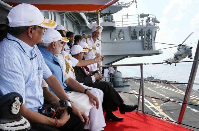 Prime Minister Narendra Modi with Minister for Defence, Manohar Parrikar witnessing the Naval air show. (PTI) Prime Minister Narendra Modi with Minister for Defence, Manohar Parrikar witnessing the Naval air show. (PTI)