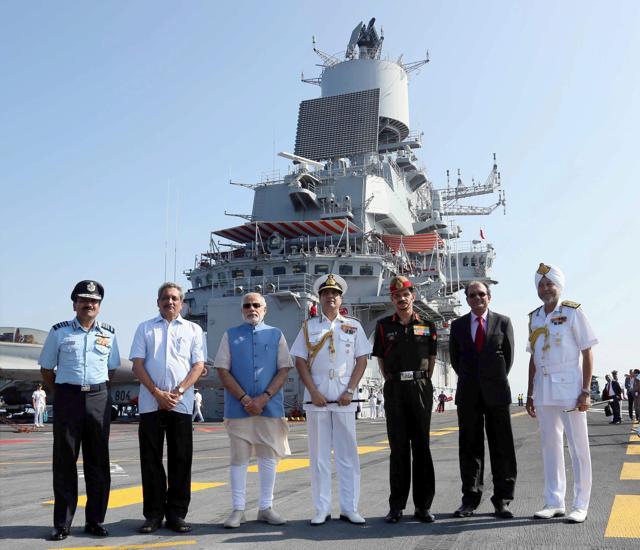 Prime Minister Narendra Modi, flanked by Union Minister for Defence, Manohar Parrikar, Air Chief Marshal Arup Raha, the Chief of Army Staff, General Dalbir Singh and the Chief of Naval Staff, Admiral R.K. Dhowan onboard INS Vikramaditya . (PTI) Prime Minister Narendra Modi, flanked by Union Minister for Defence, Manohar Parrikar, Air Chief Marshal Arup Raha, the Chief of Army Staff, General Dalbir Singh and the Chief of Naval Staff, Admiral R.K. Dhowan onboard INS Vikramaditya . (PTI)
