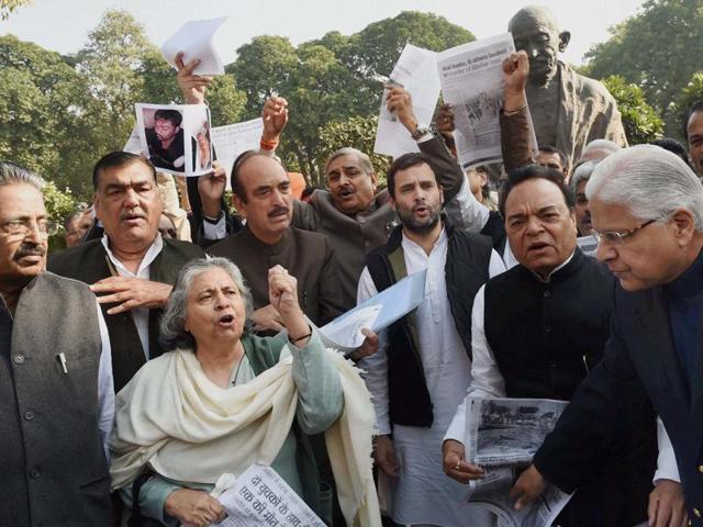 Congress vice president Rahul Gandhi shouts slogans with party MPs at protest in front of Mahatma Gandhi's statue at Parliament in New Delhi on Monday. The hope of an agreement on the GST bill dimmed by the deadlock between the government and the opposition. (PTI) Congress vice president Rahul Gandhi shouts slogans with party MPs at protest in front of Mahatma Gandhi's statue at Parliament in New Delhi on Monday. The hope of an agreement on the GST bill dimmed by the deadlock between the government and the opposition. (PTI)