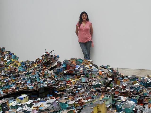 A Dharavi-themed installation where Hema Upadhyay created an aerial view of the Mumbai slum on a gallery floor using tin cans, plastic and aluminum sheets.(HT File Photo) A Dharavi-themed installation where Hema Upadhyay created an aerial view of the Mumbai slum on a gallery floor using tin cans, plastic and aluminum sheets.(HT File Photo)