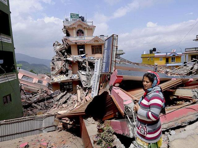 File photo of a woman standing amid the debris caused by the Nepal earthquakes. (Burhaan Kinu/ HT Photo) File photo of a woman standing amid the debris caused by the Nepal earthquakes. (Burhaan Kinu/ HT Photo)