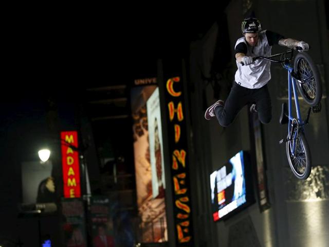A stuntman leaps in the air during a bicycle trick at the premiere of Point Break in Hollywood, California. (REUTERS) A stuntman leaps in the air during a bicycle trick at the premiere of Point Break in Hollywood, California. (REUTERS)