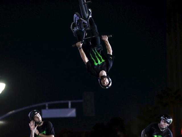 A stunt performer flips midair during a bicycle trick at the premiere of Point Break in Hollywood. (REUTERS) A stunt performer flips midair during a bicycle trick at the premiere of Point Break in Hollywood. (REUTERS)