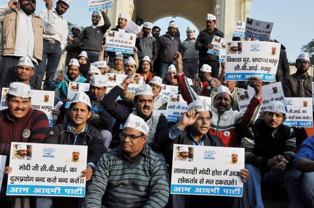 Activists of Aam Admi Party stage a protest against the CBI raid at CM Arvind Kejriwal's office, at GPO in Lucknow on Tuesday. (PTI) Activists of Aam Admi Party stage a protest against the CBI raid at CM Arvind Kejriwal's office, at GPO in Lucknow on Tuesday. (PTI)