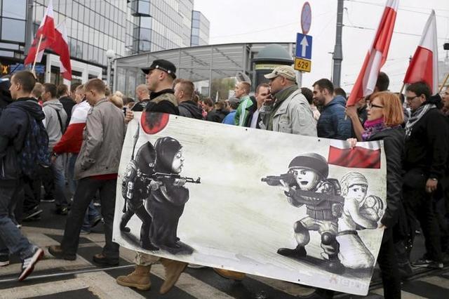 Protesters from far right organisations walk during a protest against refugees in Warsaw, Poland. Protesters from far right organisations walk during a protest against refugees in Warsaw, Poland.