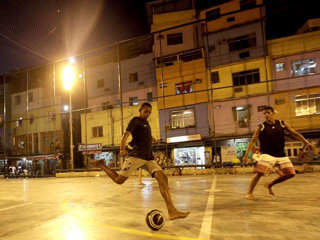 The residents of a slum in Rio De Janeiro playing football. (AP Photo) The residents of a slum in Rio De Janeiro playing football. (AP Photo)