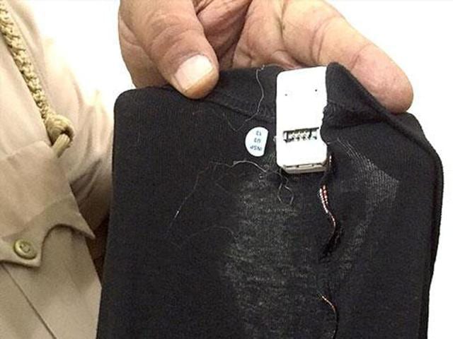 (File photo) Gadgets stitched within undergarments meant to provide various answer-keys to AIPMT candidates at the examination centre, being displayed by policemen in Rohtak. (Manoj Dhaka/ HT file Photo)